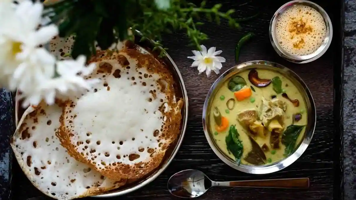 Appam with Stew - Soft-centered lacy pancakes made from fermented rice and coconut, Why it’s healthy: Light and easily digestible, Perfect with: Kerala-style vegetable or coconut milk stew.